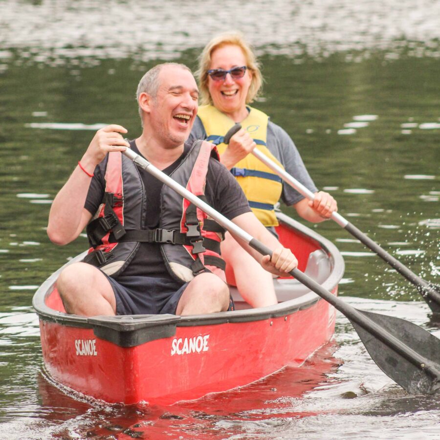 Two adults canoeing.