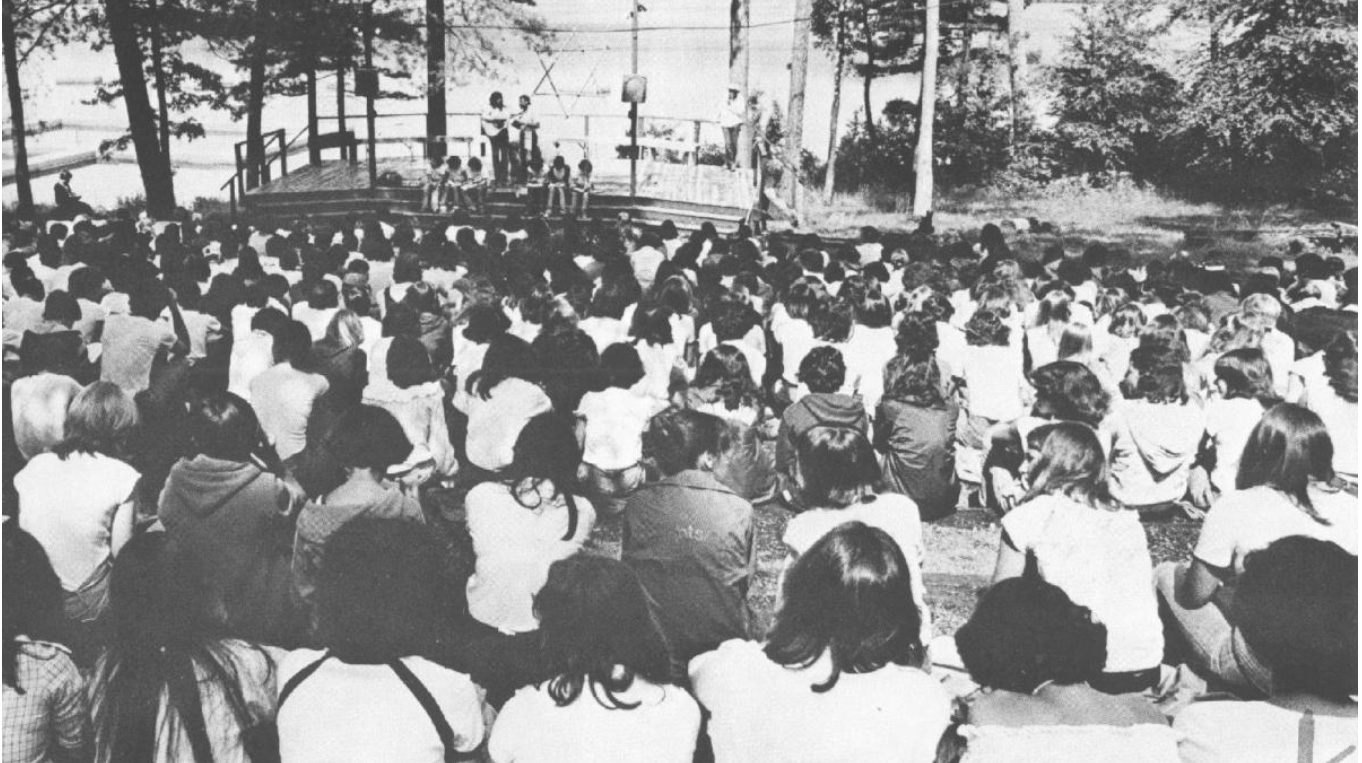 A black and white photo of campers.