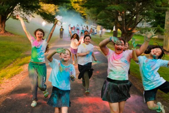 kids smiling covered in paint